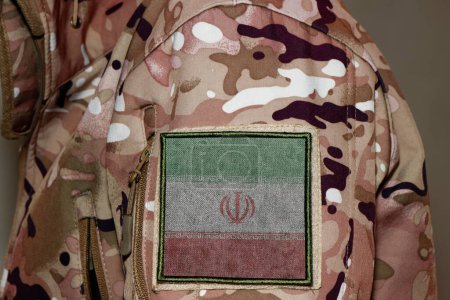 Photo for Iran Soldier. Soldier with flag Iran, Iran flag on a military uniform. Camouflage clothing - Royalty Free Image