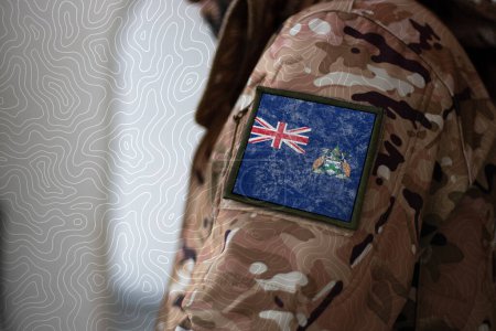 Photo for Ascension Island Soldier. Soldier with flag Ascension Island, Ascension Island flag on a military uniform. Camouflage clothing - Royalty Free Image