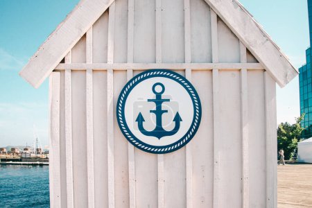 Photo for Halifax, Canada - July 21 2022: Anchor sign on the white wall of a dock shelter in Halifax - Royalty Free Image