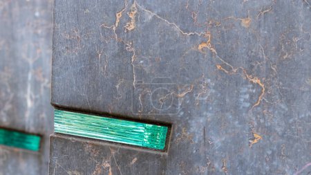 Photo for Grunge backdrop with sharp wall edge and embedded green glass element and fuzzy cracked wall lines - Royalty Free Image