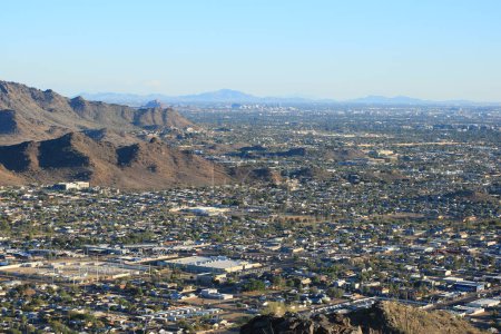 Arizona Valley of the Sun or Greater Phoenix Metro area as seen from North Mountain Park hiking trails toward South-East on late afternoon, copy space