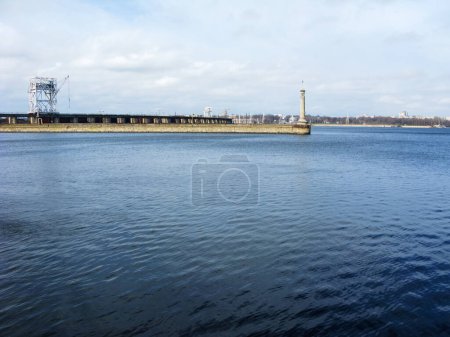 Dnieper reservoir and DniproHES dam with entrance to shipping canals in city of Zaporizhzhia, Ukraine; the DniproHES and its dam was built in the USSR with American specialists help in 1927-1932.