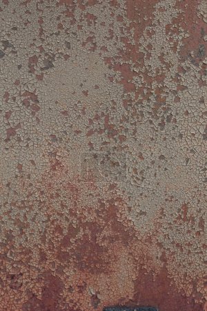 Photo for Weathered old metal surface damaged with rust. Abstract detailed texture. Wall background painted red. Easily add depth to your designs. - Royalty Free Image