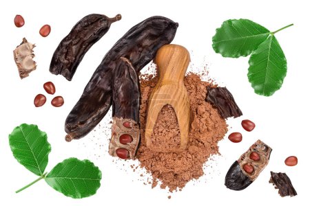 Photo for Carob pod and powder in wooden scoop isolated on white background with clipping path. Top view with copy space for your text. Flat lay. - Royalty Free Image