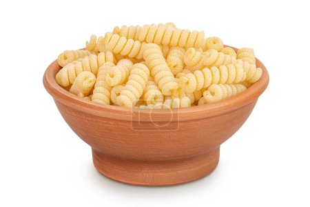 Italian spiral shaped pasta, Fusilli bucati macaroni in ceramic bowl, isolated on white background.
