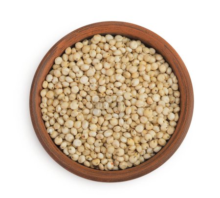 Sorghum seeds in ceramic bowl isolated on white background. Top view. Flat lay
