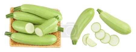 Photo for Zucchini or marrow in a wicker basket isolated on white background with full depth of field. Top view. Flat lay. - Royalty Free Image