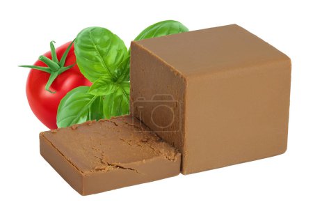 Brown cheese. Norwegian brunost isolated on white background with full depth of field.