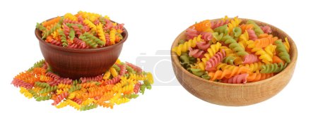 raw Fusilli in ceramic bowl colored pasta, isolated on white background with full depth of field.