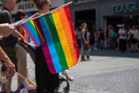 Photo for Munich, Germany, 24 June 2023: Close up of rainbow flags held by a man during Gay Pride in Munich - Royalty Free Image
