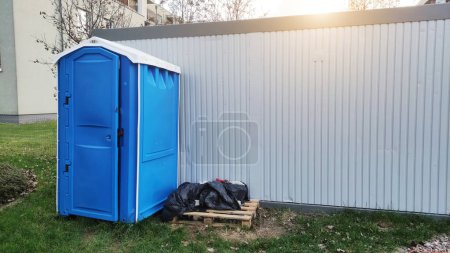 Photo for Portable toilet cabin wc restroom, copy space on metal container. - Royalty Free Image