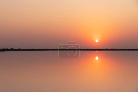 Photo for Reflection of the sun in a salt lake. Neftchala. Azerbaijan. - Royalty Free Image