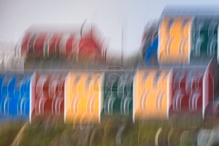 Intentional Camera Movement (ICM) creates unique patterns of houses in Sisimiut that are painted in bright reds, yellows, blues and greens.