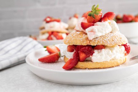 Photo for Strawberry shortcake on a white plate - Royalty Free Image