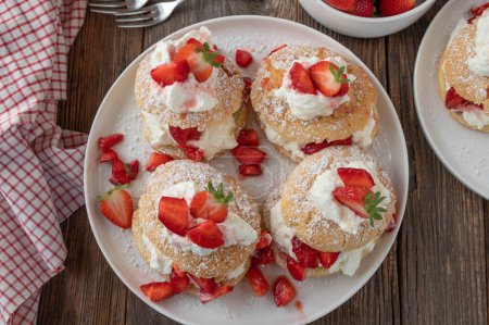 Photo for Strawberry shortcake on wooden table - Royalty Free Image