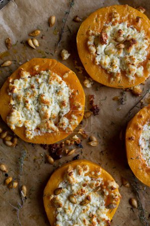 Photo for Baked butternut squash with goat feta cheese and pumpkin seeds - Royalty Free Image