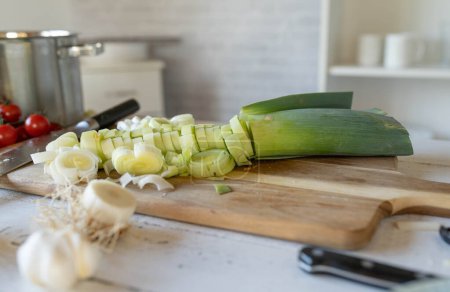 Fresh cut or chopped leek on a cutting board in the kitchen
