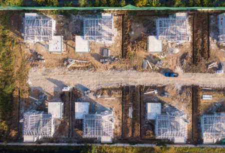 Photo for Aerial top view of suburban housing estate development under construction for residential industry planing - Royalty Free Image