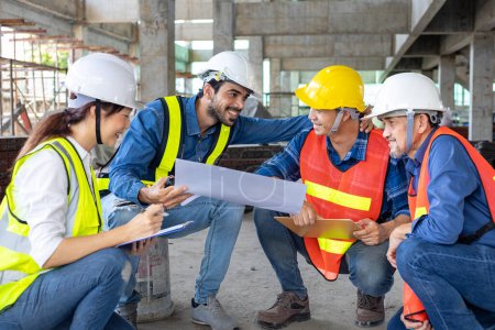 Team of engineer, architect, contractor and foreman meeting and consulting at the construction building site with floor plan for real estate development project industry and housing timeline