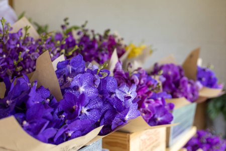 Photo for Flower shop with purple vanda orchid in the bouquet ready for sale at the floral stand for florist and flower arranging concept - Royalty Free Image