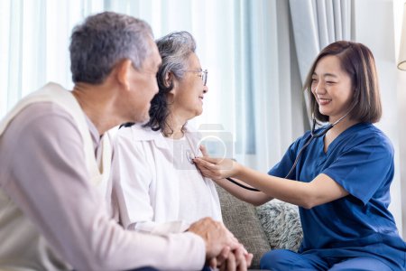 Senior couple get medical service visit from caregiver nurse at home while having medical checkup on heart and cardiovascular system for health care and pension welfare insurance