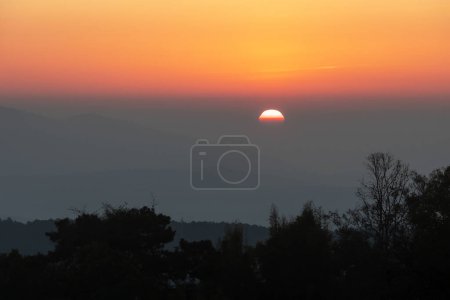 Photo for Amazing colorful sunrise over the rainforest mountains at the Ob Luang natinoal park, Chiangmai, Thailand - Royalty Free Image
