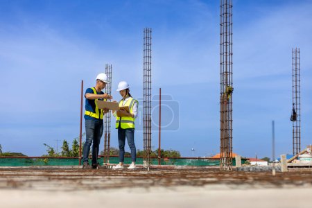 Photo for Team of engineering architect inspector and contractor are having discussion while examining the quality of construction work of real estate development project - Royalty Free Image