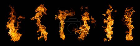 Foto de El conjunto de fuego y llama ardiente aislado sobre fondo oscuro para el uso de diseño gráfico - Imagen libre de derechos