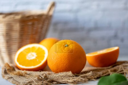 Photo for Fresh orange studio packshot with whtie brick background for citrus and summer fruit harvest - Royalty Free Image