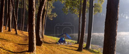 Photo for Panorama single offgrid tent for overnight camping with sun light over the misty mountain and ray of light and campsite of Pang Oung, Mae Hong Son, Thailand - Royalty Free Image