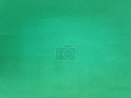 Mint green velvet fabric texture used as background. Empty mint fabric background of soft and smooth textile material. There is space for text.