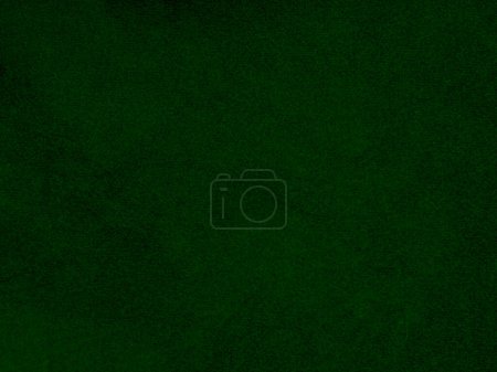 Dark green old velvet fabric texture used as background. Empty green fabric background of soft and smooth textile material. There is space for text..	
