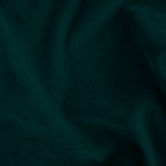 Dark green old velvet fabric texture used as background. Empty green fabric background of soft and smooth textile material. There is space for text..