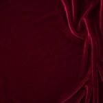 Red velvet fabric texture used as background. red panne fabric background of soft and smooth textile material. crushed velvet .luxury scarlet for silk.