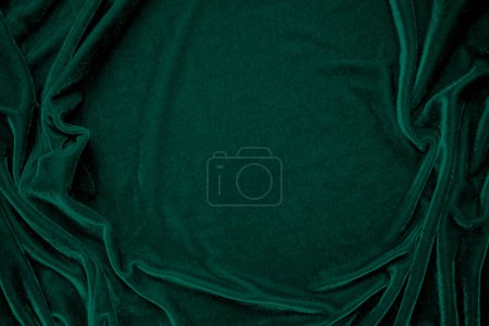 Texture de tissu de velours vert utilisé comme fond. Peacock couleur panne tissu fond de matériau textile doux et lisse. velours broyé .luxury ton émeraude pour la soie.