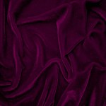 pink velvet fabric texture used as background. Wine color panne fabric background of soft and smooth textile material. crushed velvet .luxury magenta tone for silk.