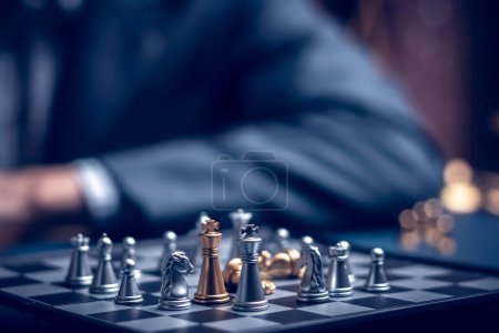 Foto de Businessman playing chess think problem solving. business competition planning teamwork,International chess, ideas and competition and strategy, business success concept,strategic concept.. - Imagen libre de derechos
