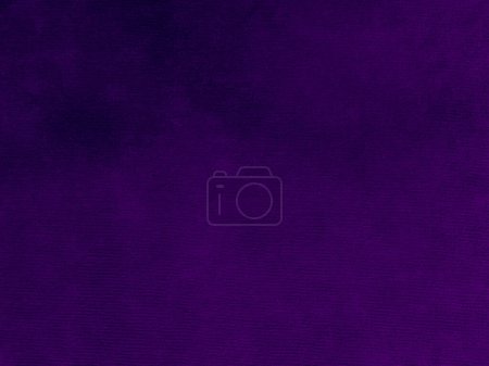 Texture en velours violet foncé utilisé comme fond. Couleur violette panne fond de tissu de matériau textile doux et lisse. velours broyé .luxury ton magenta pour la soie.