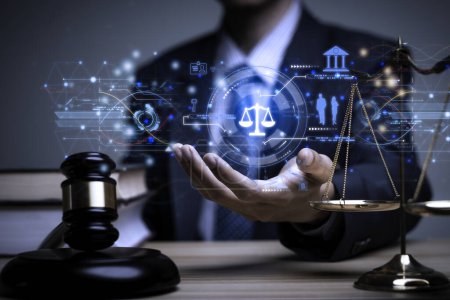 Lawyer's hand concept Justice with Judge gavel, Businessman in suit or Hiring lawyers in the digital system. Legal law, prosecution, legal adviser, lawsuit, detective, investigation,legal consultant.	