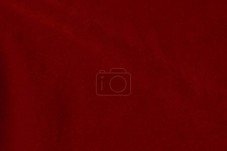 Textura de tela de terciopelo rojo oscuro utilizada como fondo. seda color escarlata tela fondo de material textil suave y liso. terciopelo triturado .luxury tono oscuro para la seda.