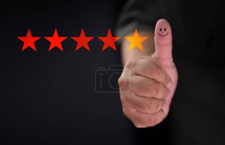 Customer satisfaction concept. Hand with thumb up Positive emotion smiley face icon and five star 