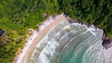 Foto de Aerial view of Jerubucacu beach in Itacare, Bahia, Brazil. Tourist place with sea and vegetation. - Imagen libre de derechos