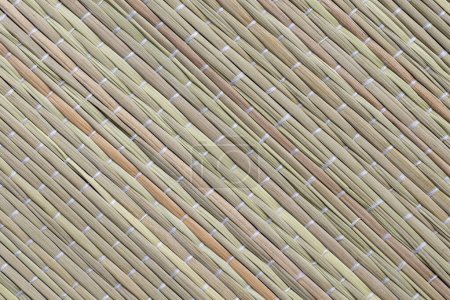 Photo for Straw beach mat texture. Closeup shot of beach and picnic blanket or yoga mat made of straw - Royalty Free Image