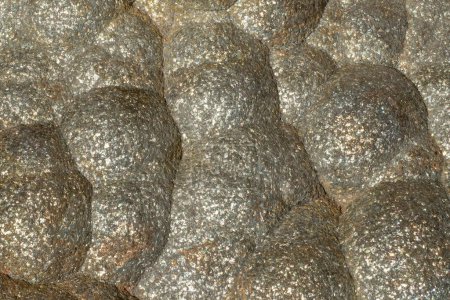Foto de Glistening surface of marcasite mixed with pyrite. Natural mineral stone background - Imagen libre de derechos