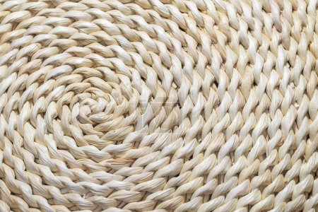 Photo for Natural handmade maize straw mat. Spiral pattern - Royalty Free Image