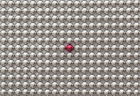 Foto de Marco completo de bolas magnéticas de metal para el fondo. Las Esferas Neocube con una esfera roja. Destacar entre la multitud - Imagen libre de derechos