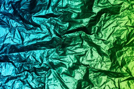 Photo for Metallic aqua green color scheme. Bicolor crumpled foil as the background texture - Royalty Free Image