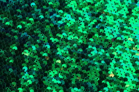 Photo for A close-up of a green sequin covered fabric. Background texture - Royalty Free Image