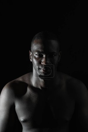 close-up of an African-American man's face on a black background with 90-degree illumination