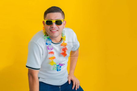 young latino man looking intently straight ahead with a doubtful face and a slightly tilted face. sunglasses